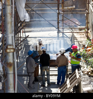 Workers on site having BBQ lunch Stock Photo