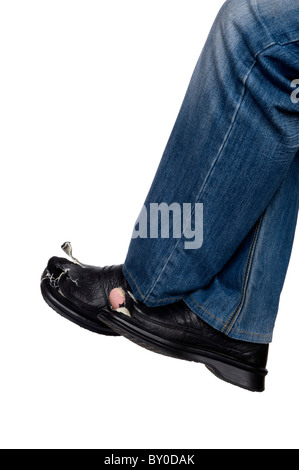 object on white - men feet in blue jeans and Damaged old boots Stock Photo