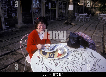 Frenchwoman, French woman, French, woman, drinking coffee, cafe, salon de the, Pont du Gard, town of Vers-Pont-du-Gard, Languedoc-Roussillon, France Stock Photo