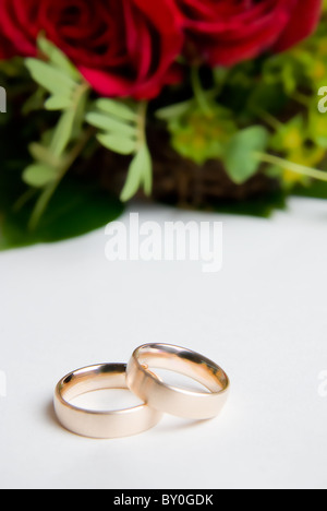 Red Roses With 2 Rings Two rings in front of a red rose and a pearl necklace Stock Photo - Alamy