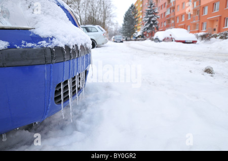 Icicles on a car - dangerous road conditions in winter months Stock Photo
