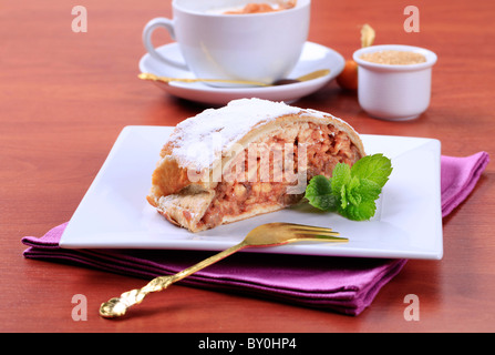 Slice of apple strudel and a cup of coffee Stock Photo