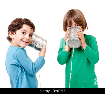 Two boys talking on a tin can phone isolated on white Stock Photo