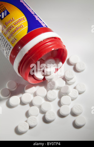 low dose 75g aspirin pills around open container Stock Photo