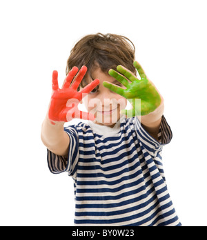 young boy with hands painted in red and green Stock Photo