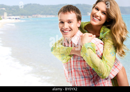 photo of young happy couple enjoying themselves at sea during holiday
