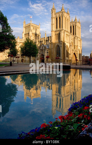 Bristol cathedral in evening light reflected in the waters of the Council House moat on College Green Stock Photo