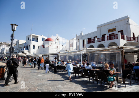 Red-domed church and restaurants at the seafront in Mykonos. Stock Photo