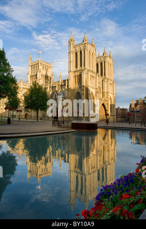 Bristol cathedral in evening light reflected in the waters of the Council House moat on College Green Stock Photo