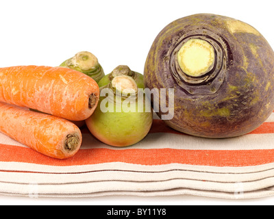 Fresh Raw Uncooked Root Vegetables Including Swede Turnips Carrots And Parsnips Isolated Against A White Background With No People And A Clipping Path Stock Photo