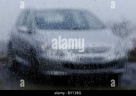 Rain lashing against a kitchen window Stock Photo