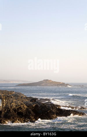 Pessegueiro Island seen from the rocky coastline of Porto Covo on Portugal's Alentejo coast. Stock Photo