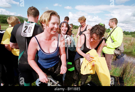 People coming out of the water at The Bog Snorkeling World Championships, Llanwrtyd Wells, Mid Wales. Stock Photo