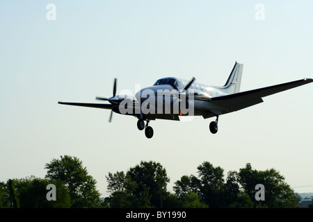 Private prop plane Beechcraft King Air C90A approaches the runway at Cantrell Field. Stock Photo