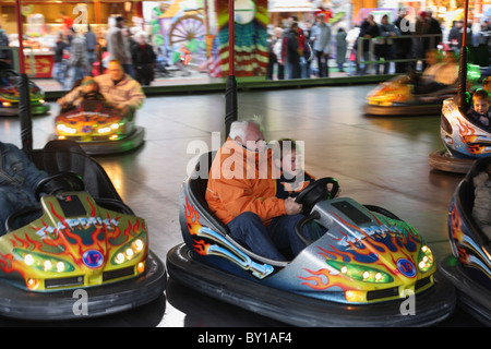 A grandfather with his grandson in a bumper car, Bremen, Germany Stock Photo