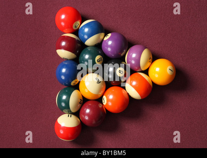 fifteen billiard balls arranged in triangle on pool table Stock Photo