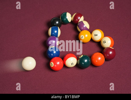 breaking heart concept using billiard balls Stock Photo