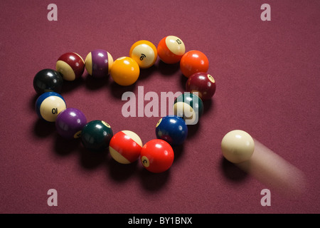 breaking heart concept using billiard balls Stock Photo