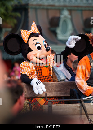 the Minnie Mouse Disney character waving at the crowds during the parade on main street Eurodisney Paris France Halloween season Stock Photo