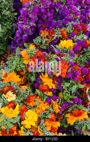 Baskets of flowers at an indian market for making garlands for hindu devotion. Andhra Pradesh, India Stock Photo