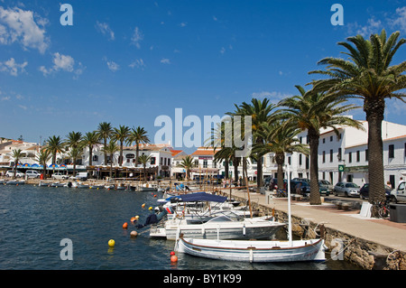 Spain, Menorca.  Boats moored in the harbour of the fishing village of Fornells. Stock Photo