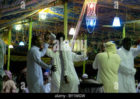 Bedouin groom dances with guests during a traditional wedding celebration. El Tur, Sinai Peninsula, Egypt Stock Photo