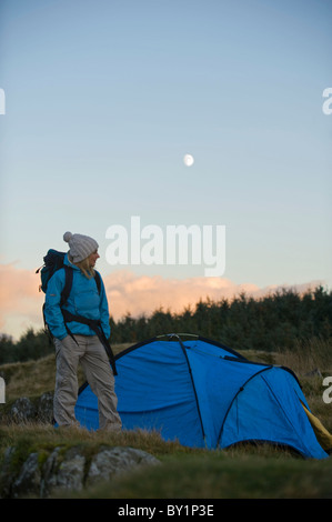 North Wales, Snowdonia, Gilar Farm.  Woman camping in the wild. Stock Photo