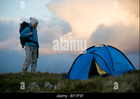 North Wales, Snowdonia, Gilar Farm.  Woman camping in the wild. (MR) Stock Photo