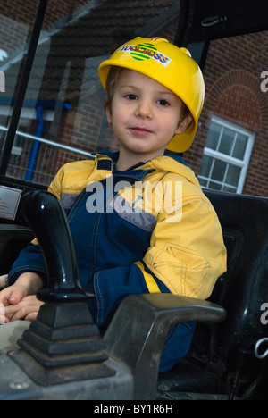Boy in mini digger Stock Photo