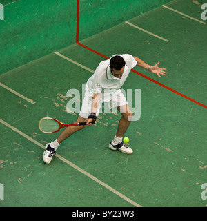 France, Aquitaine, Pau.  The ancient game of real tennis in progress on the old court at Pau.  Real tennis, or jeu de paume, is Stock Photo