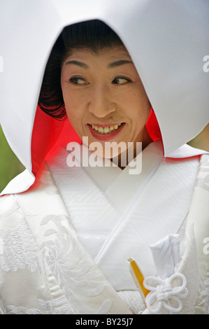 Asia, Japan. Kyoto, Kamigamo Jinja shrine, woman in bridal gown Stock Photo