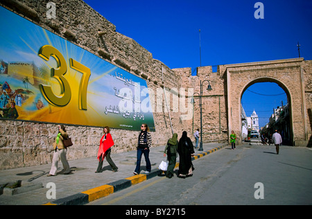 Tripoli, Libya; Tourists walking outside the gate to the Ancient Medina in front of Green Square Stock Photo