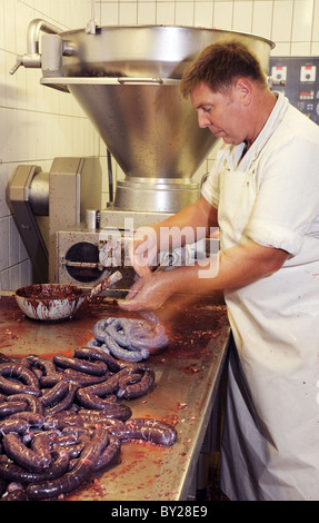 Butcher making German sausage ( Black pudding, Blutwurst )in Butcher's Hambel shop Deidesheim , Bad Dürkheim, Rhineland-Palatinate,  Germany, Europe Stock Photo