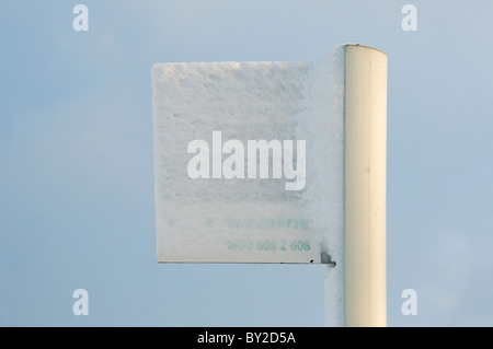 Ice and snow covered 'bus stop' sign in North Berwick, East Lothian, Scotland. Stock Photo