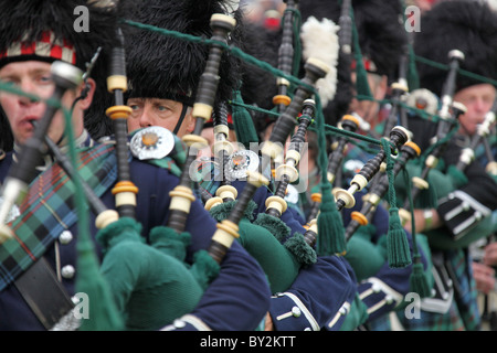 Village of Braemar, Scotland. The massed pipe bands marching at the Royal Braemar Gathering games. Stock Photo