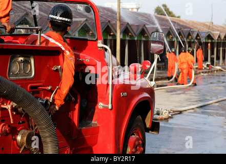 Primitive burmese fire engine and firefighters in the small Shan town of Hsipaw, Myanmar. Stock Photo