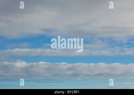 Great layered clouds floating in the sky above. Stock Photo