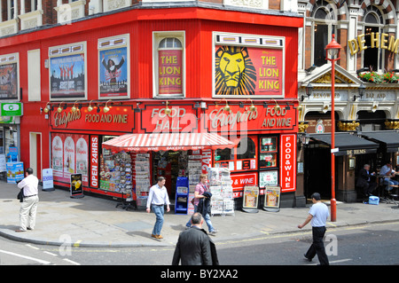 Street scene colorful Crispins Food Wine News & Bakery Hall corner shop theatreland advertising in Shaftsbury Avenue Soho West End London England UK Stock Photo