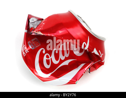 Crumpled crushed Coca Cola can. On white background. Stock Photo