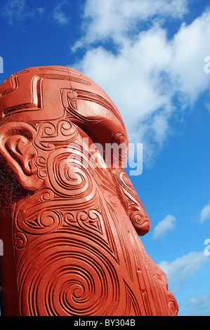 Carved maori warrior faces in New Zealand Stock Photo