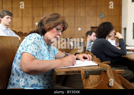 A pensioner in a lecture hall Stock Photo