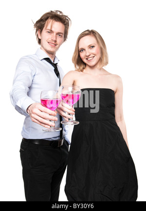 Young couple toasting with pink drink. Selective Focus. Studio photo, isolated. Stock Photo