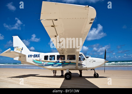 A light aircraft offering tours off the 75 mile beach on Fraser Island, Australia. Stock Photo