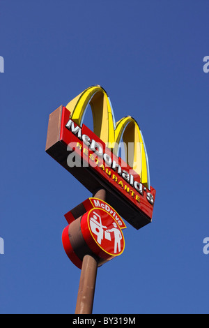 McDonalds restaurant McDrive sign against a blue sky Stock Photo