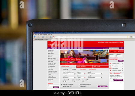 Booking a flight via the Virgin Atlantic Airways site on a laptop computer, UK Stock Photo