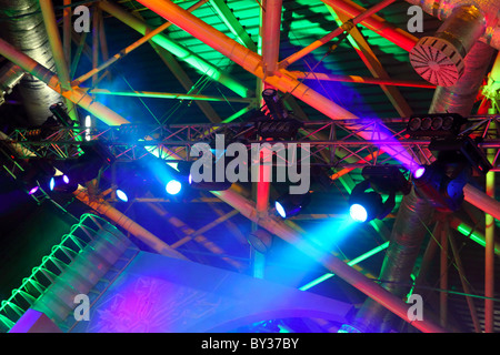 lighting equipment at concert - colored spotlights on ceiling Stock Photo