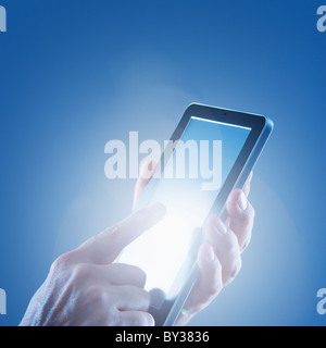 Young woman's hands using digital tablet Stock Photo