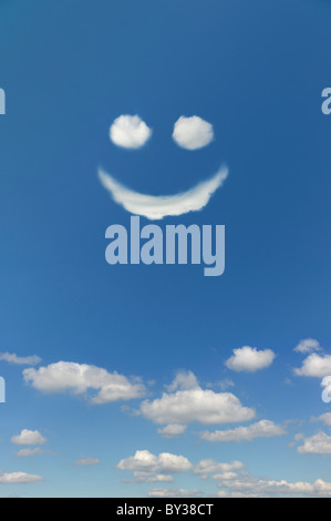 Clouds forming smiley face in sky Stock Photo