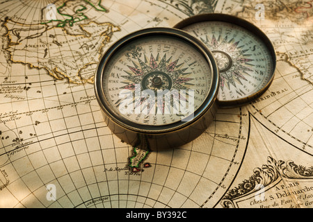 Antique compass on map Stock Photo