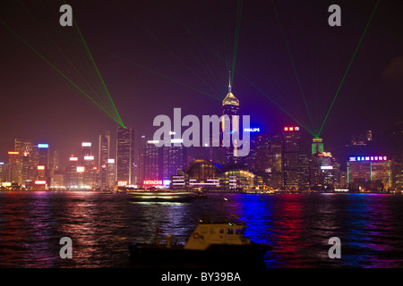 Laser light show Hong Kong Island at night viewed across Victoria Harbour from Kowloon. JMH4153 Stock Photo